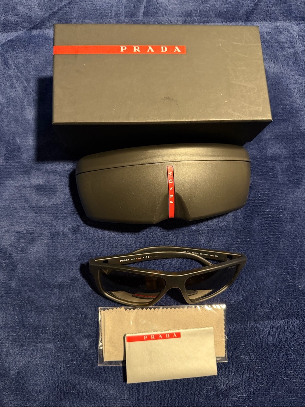 Prada Black Sunglasses with Red Logo Accent